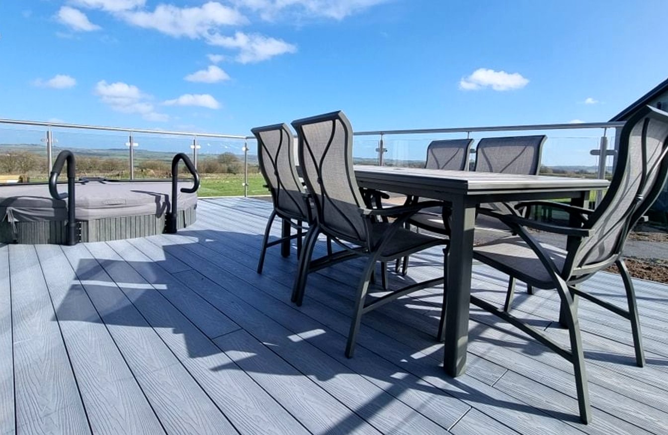Glass balustrade and hot tub on lodge decking with countryside views, Haystax, Lanchester