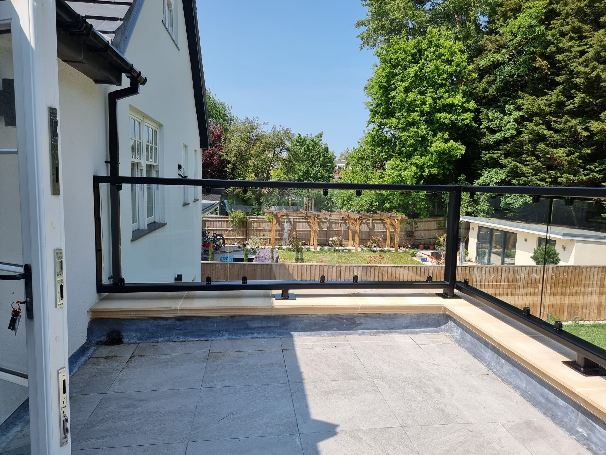 Rear elevation showing parapet glass balustrade wrapping corner of first floor flat roof extension, Oxford