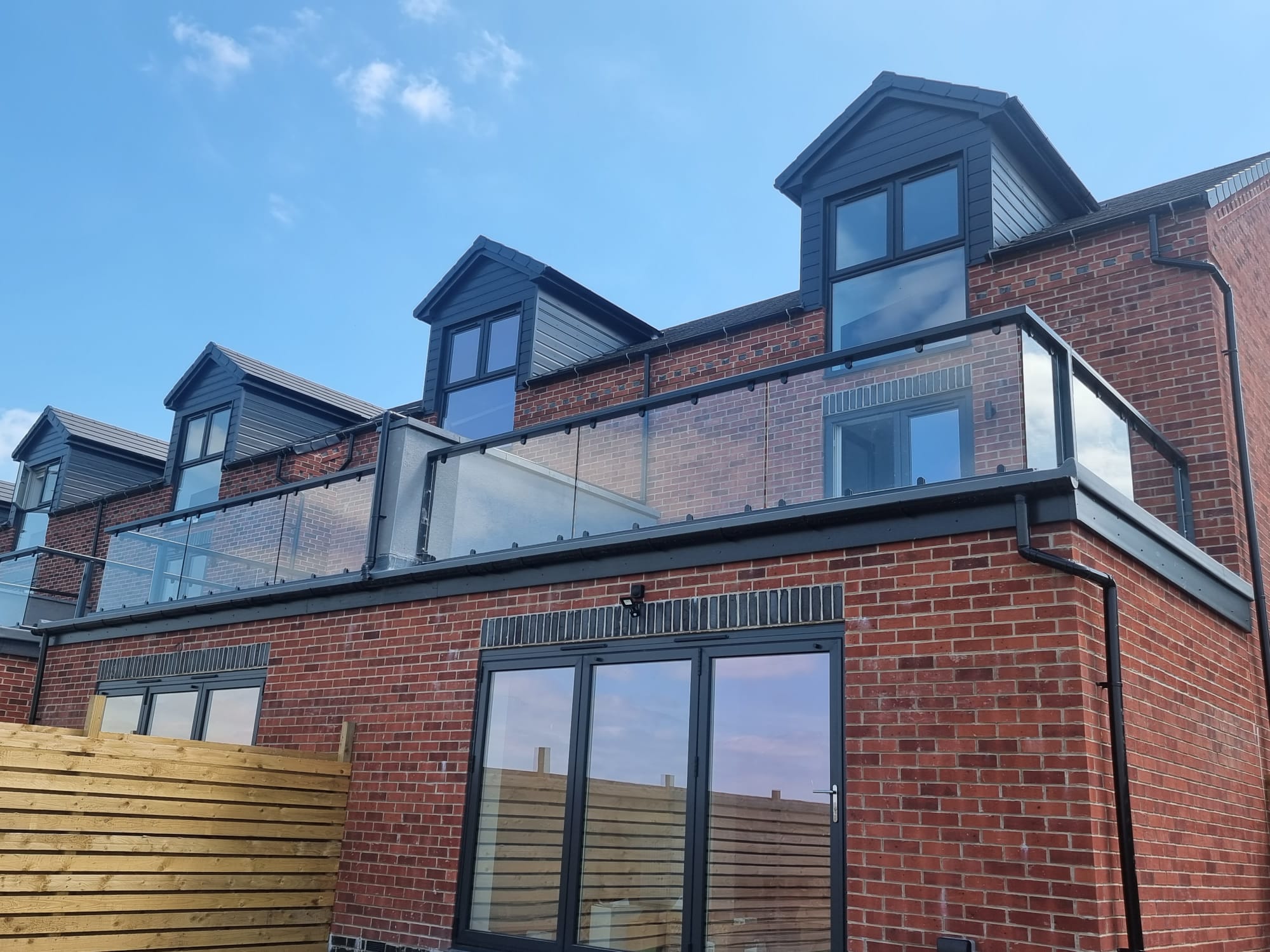 large-flat-roof-glass-balustrade-install-waterproof-membrane