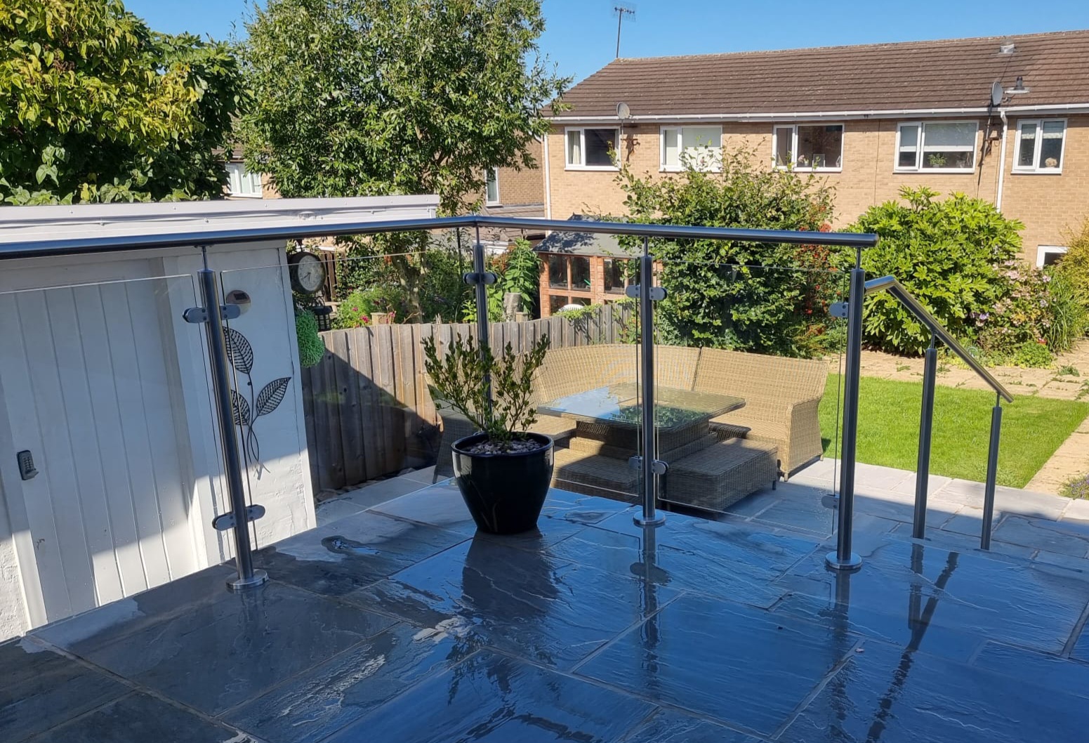 Installing glass balustrades to paving slabs on raised patio