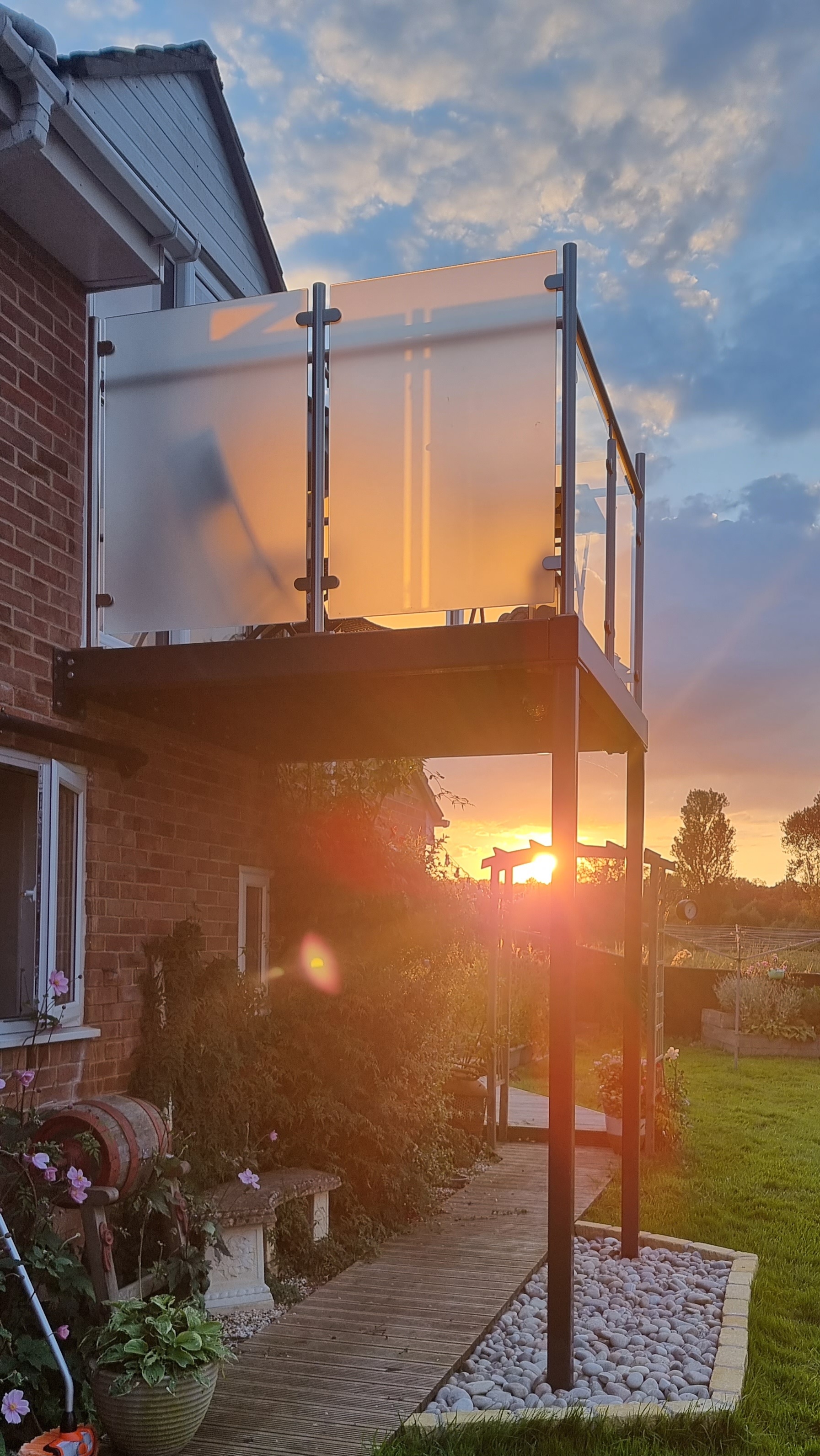 diomet walkout balcony diy installation with setting sun