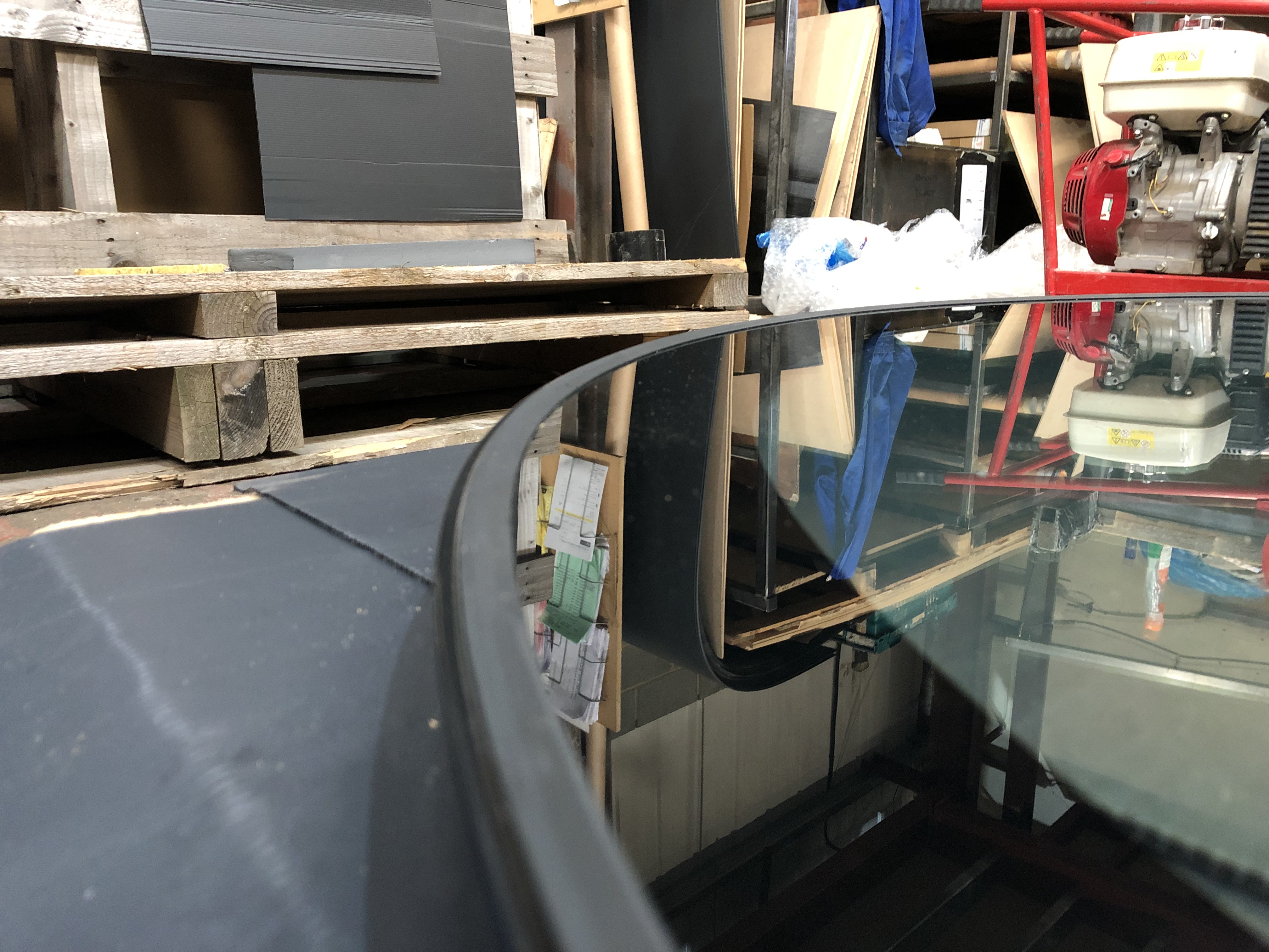 Structural walk-on glass with 50mm black border and slender steel support frame, manufactured in Sheffield