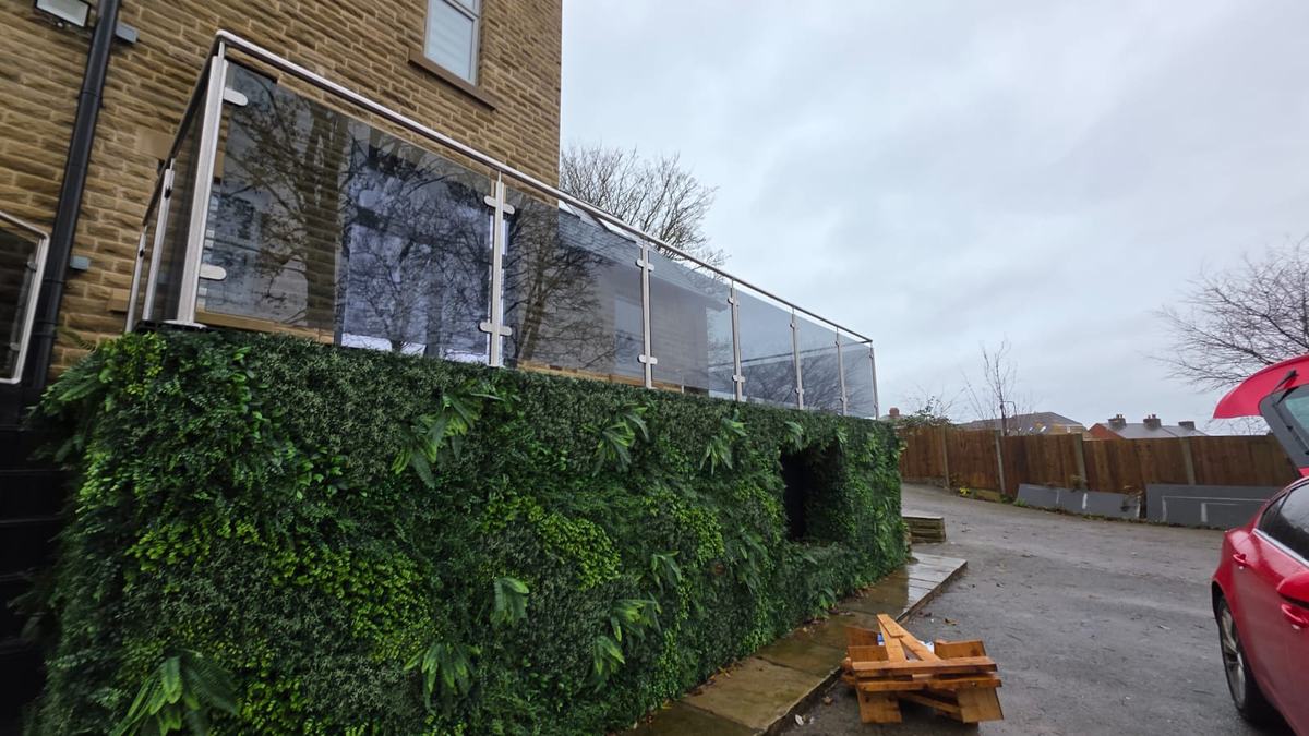 Seven metre run of tinted glass and stainless steel decking balustrade above a living wall, Barnsley