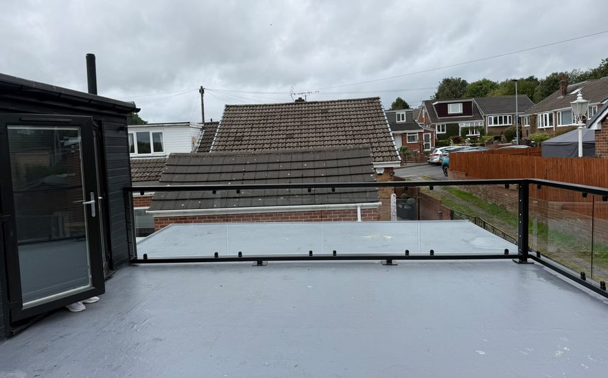 Large flat roof terrace with steel framed glass balustrade, Barnsley South Yorkshire