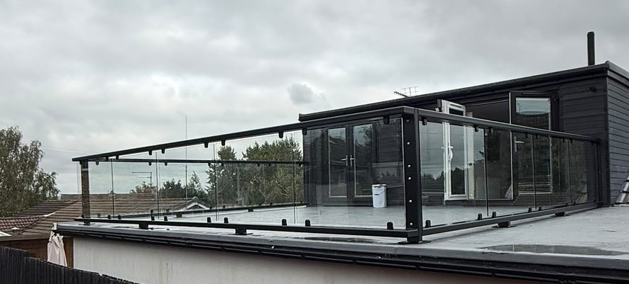 Flat roof terrace with glass balustrade on a dormer bungalow in Barnsley