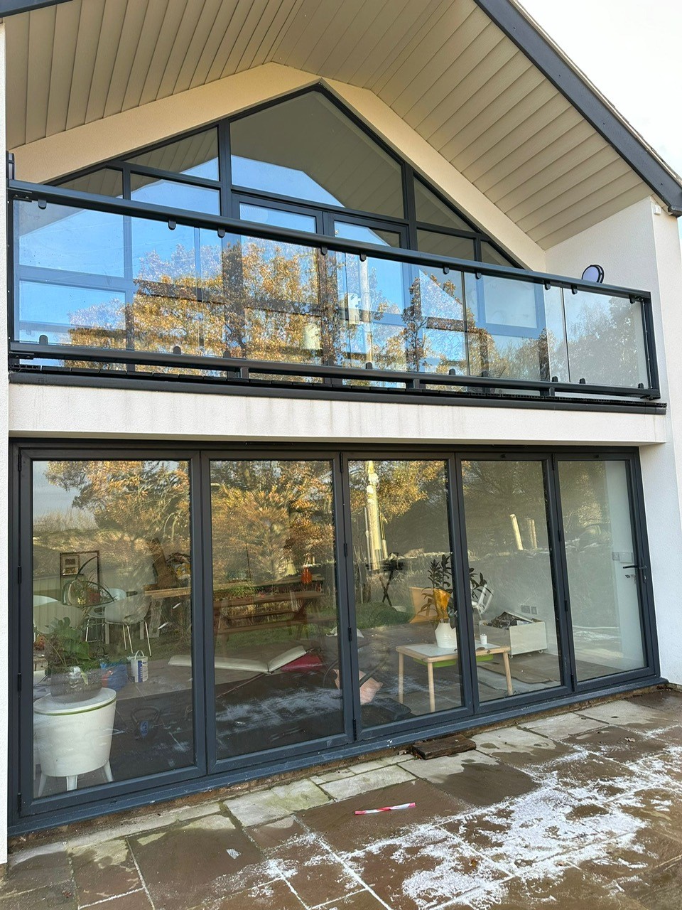 Anthracite Grey RAL 7016 inset glass balcony installed on a modern home in Sheffield, Yorkshire.