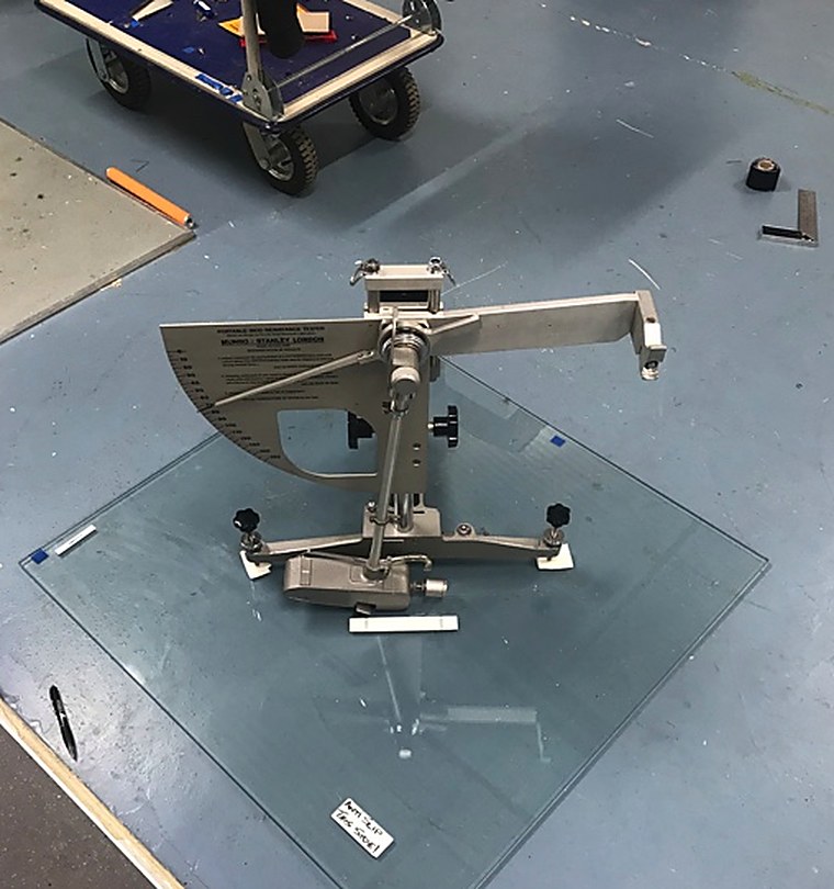 Munro pendulum slip tester on a sample of anti-slip treated walk-on floor glass