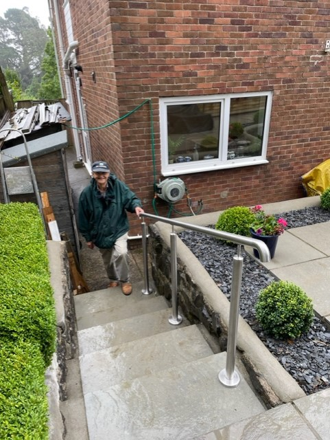Stainless steel tubular access handrail fitted to outdoor garden steps in Rotherham