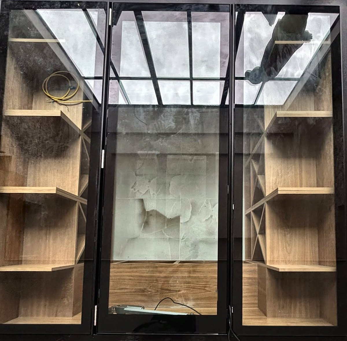 Walk-on glass floor in three sections over a new wine cellar, Swindon