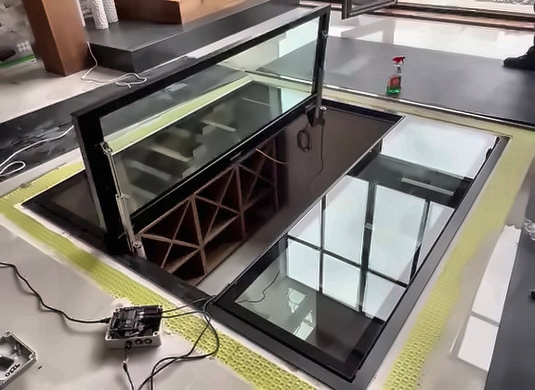 Linear actuator and stainless steel hinges on an electric glass floor door, Swindon