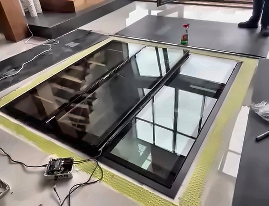 Three section walk-on glass floor closed flush with the surrounding floor, Swindon