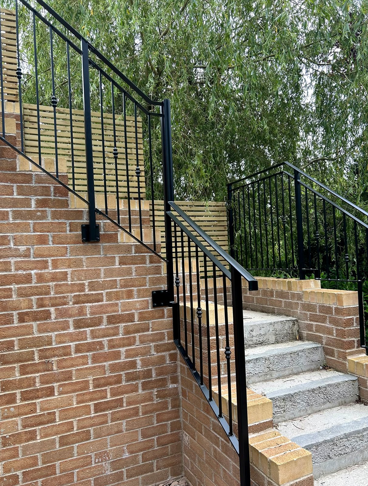 Black metal balustrade railings to an external garden staircase, Sheffield S11