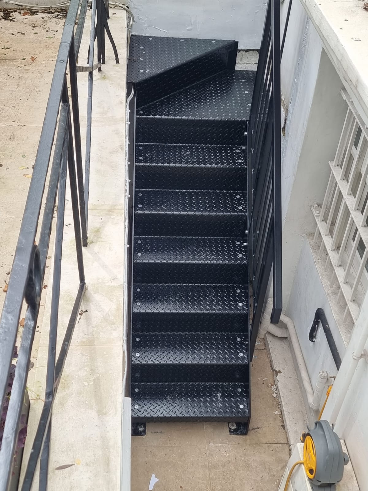 Steel kite winder staircase giving basement access in a London property