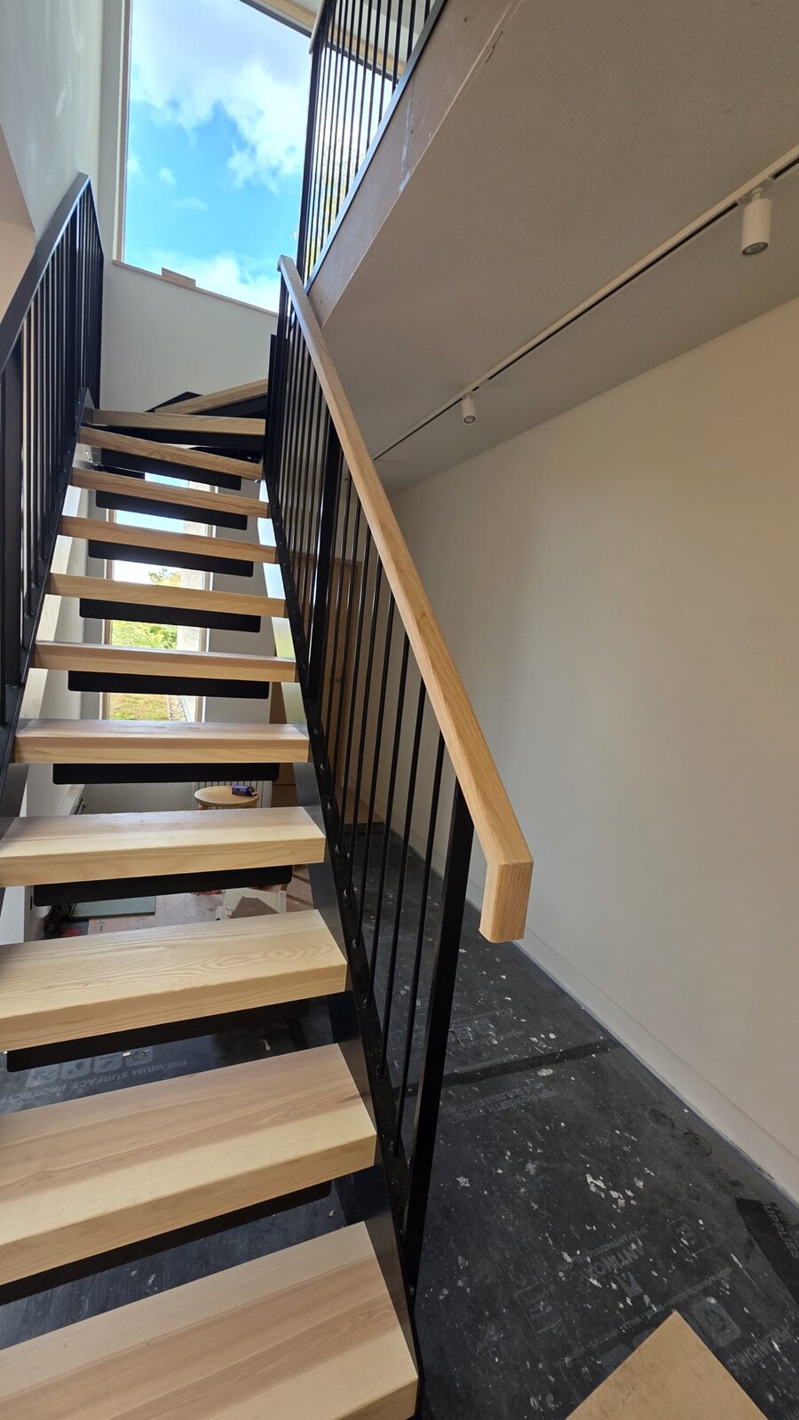 Second flight steel staircase with ash treads, ash handrail and kite winder, Chorlton Manchester