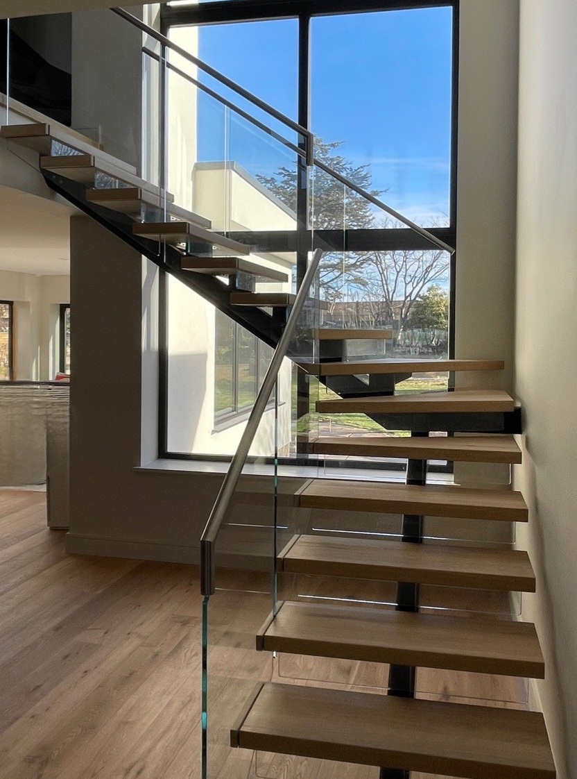 Floating Oak Tread Spine Staircase with Glass
