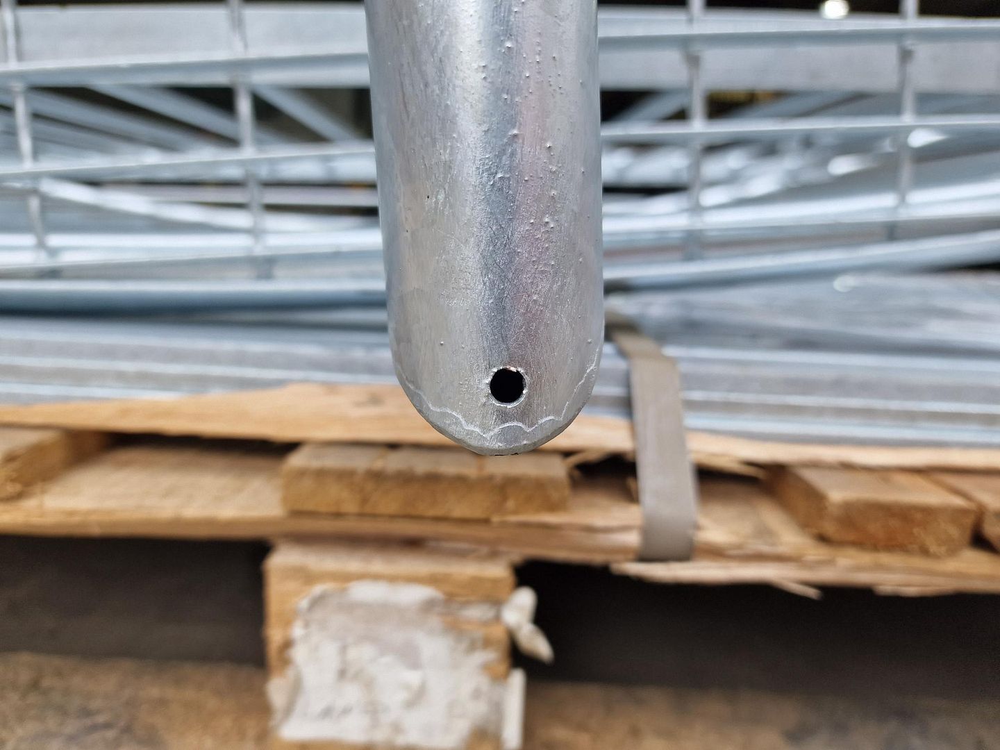 Vent holes drilled in hollow steel section to allow air to escape during galvanizing