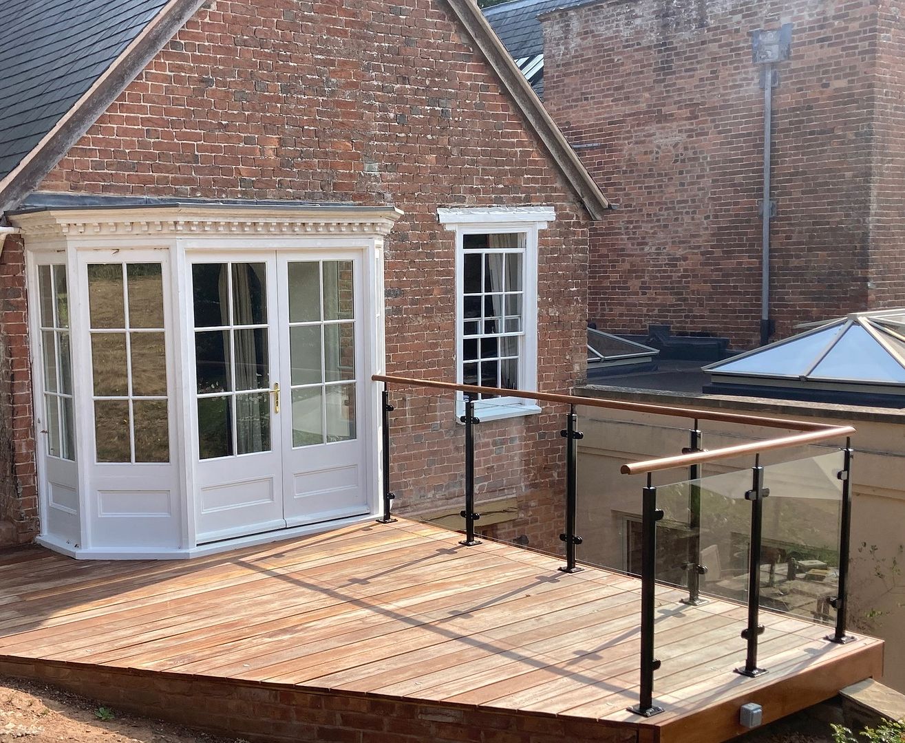 powdercoated glass balustrade oak handrail UK